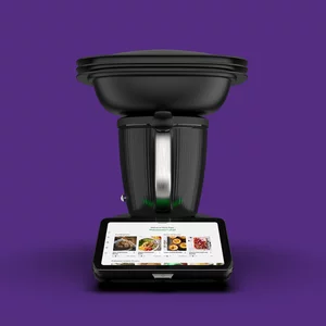 Vorwerk: Photo: The black TM7 from the front, against a purple background.